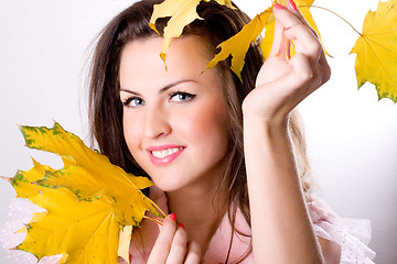 Image showing woman with yellow leaves 