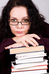 Image showing attractive woman with stack of books