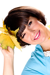 Image showing woman with yellow leaves
