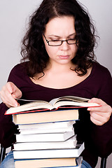 Image showing woman with stack of books