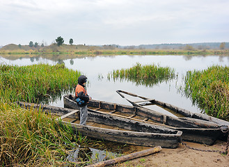 Image showing The boy and the boat.