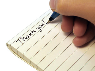 Image showing Note book, someone writing 'Thank You!'