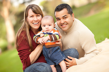 Image showing Happy Mixed Race Family Posing for A Portrait