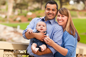 Image showing Happy Mixed Race Family Posing for A Portrait