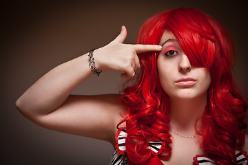 Image showing Attractive Young Red Haired Woman with Hand To Her Head 