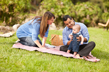 Image showing Happy Mixed Race Family Playing In The Park