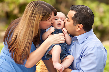 Image showing Happy Mixed Race Parents Playing with Their Son