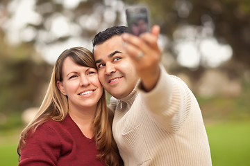 Image showing Attractive Mixed Race Couple Taking Self Portraits