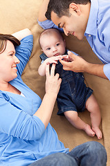 Image showing Mixed Race Family Playing on the Blanket