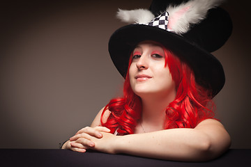 Image showing Attractive Red Haired Woman Wearing Bunny Ear Hat