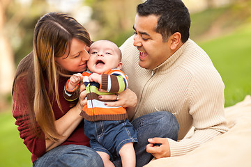 Image showing Happy Mixed Race Parents Playing with Their Son