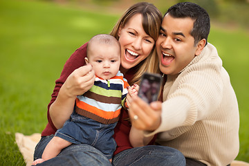 Image showing Happy Mixed Race Parents and Baby Boy Taking Self Portraits