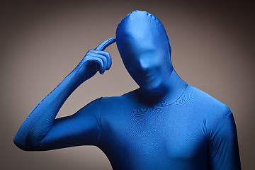 Image showing Man Wearing Full Blue Nylon Bodysuite Scratching Head