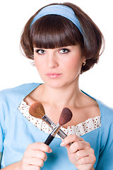 Image showing woman in blue dress with two make-up brushes 