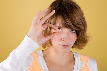 Image showing young woman with pill