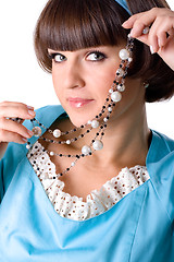 Image showing woman in blue dress with pearl beads