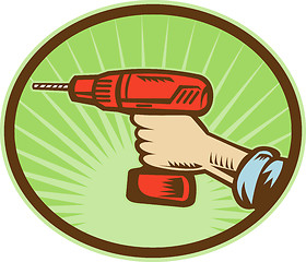 Image showing Hand holding a cordless drill