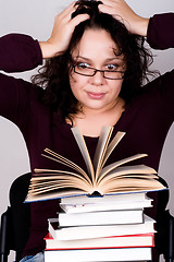 Image showing woman with stack of books