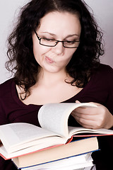 Image showing woman with stack of books