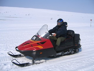 Image showing Riding snowmobile