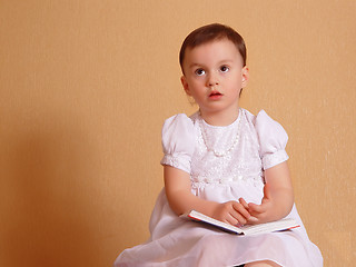 Image showing Girl dreaming in a white dress