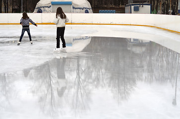 Image showing girls on the skating rink in spring