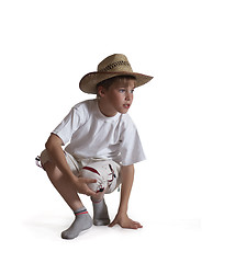 Image showing Sitting boy straw hat on white background