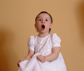 Image showing Girl singing in a pink dress