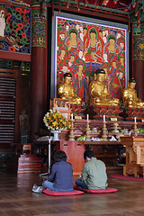 Image showing Praying to Buddha