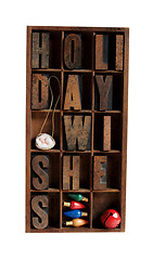 Image showing holiday wishes in letterpress type in an old wood case