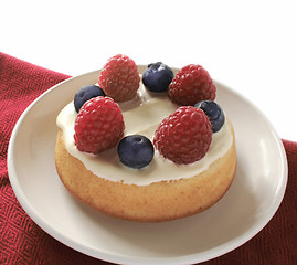 Image showing small cake dessert  with raspberries and blueberries