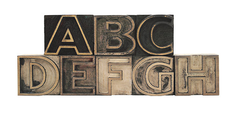 Image showing outline letters in wood A-H