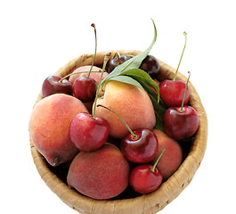 Image showing peaches and cherries in a basket