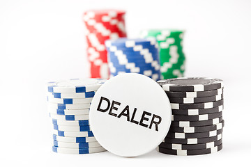 Image showing Poker chips and dealer button