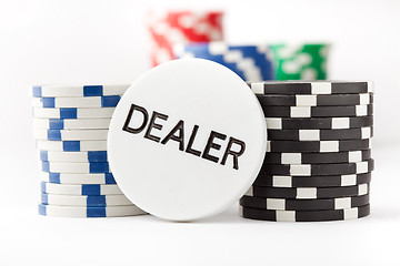 Image showing Poker chips and dealer button