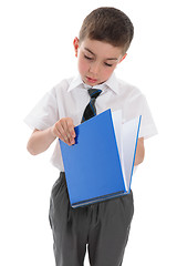 Image showing School boy with blue book