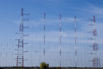 Image showing a row of electricity pylons