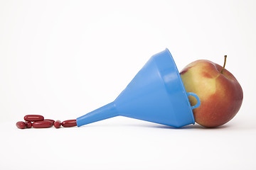 Image showing blue funnel, apple and pills