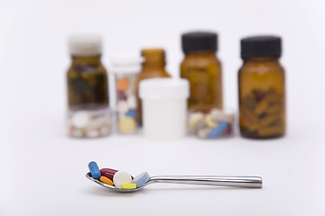 Image showing differently pills in spoon