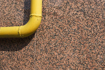 Image showing yellow pipe on marble background