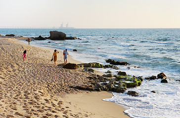 Image showing Walking along the beach 