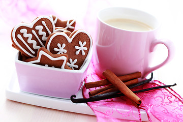 Image showing cup of coffee with cookies