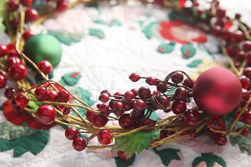 Image showing wreath with berries on a quilt