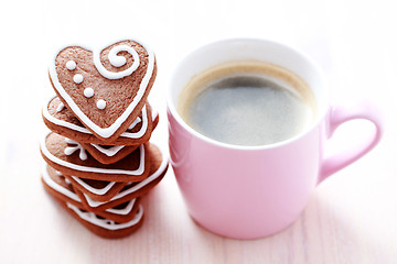 Image showing cup of coffee with cookies
