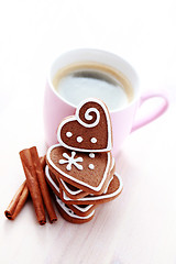 Image showing cup of coffee with cookies