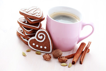 Image showing cup of coffee with cookies