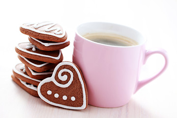 Image showing cup of coffee with cookies