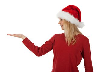 Image showing Christmas girl holding hand palm up
