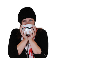 Image showing Girl drinking tee.