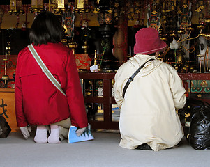 Image showing Praying in the temple